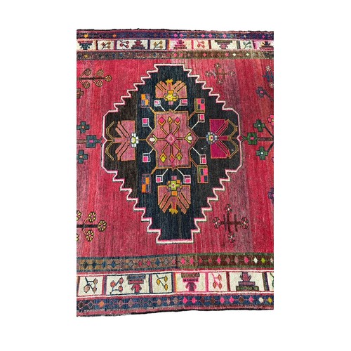 47 - Large Eastern (possibly Turkish) woven ground rug, stylised floral and geometric pattern with red ba... 