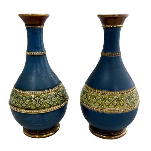 247 - A pair of attractive small blue, green and gold vases with raised beaded decoration. Hairline crack ... 