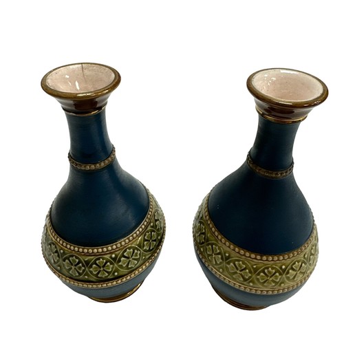 247 - A pair of attractive small blue, green and gold vases with raised beaded decoration. Hairline crack ... 