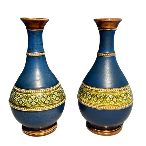 247 - A pair of attractive small blue, green and gold vases with raised beaded decoration. Hairline crack ... 