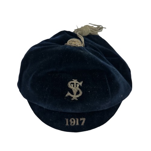 416 - A vintage blue velvet cricket cap, dated 1917. Embroidered with the letters S I and V.