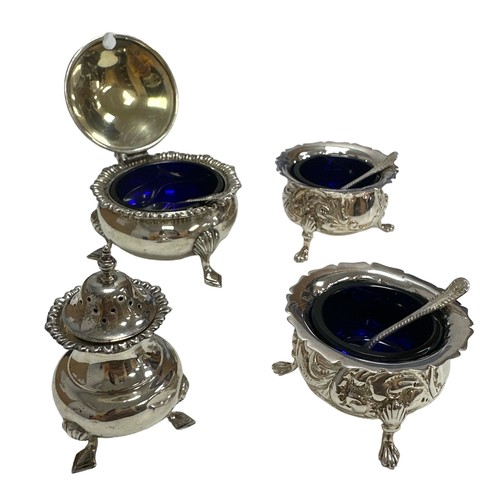 215 - Two silver salts and a mustard pot with blue liners and spoons. Also a silver sugar shaker.  Total w... 