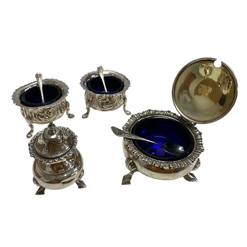 215 - Two silver salts and a mustard pot with blue liners and spoons. Also a silver sugar shaker.  Total w... 