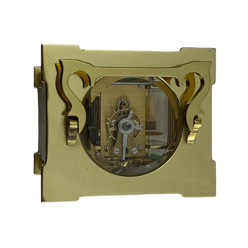 132 - A brass cased carriage clock with bevelled glass panels, Matthew Norman, Swiss Made, complete with k... 