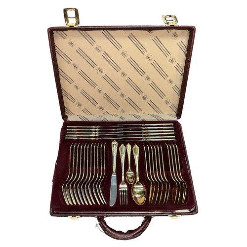 218 - BESTECKE SOLINGEN; a seventy-piece gold plated cutlery set in a leather-style briefcase, over two ti... 