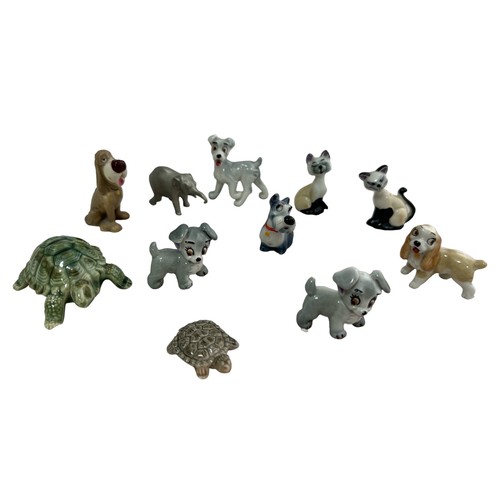 242 - Eleven animal figures, including some Wade Whimsey figures, a pewter elephant etc. Large turtle has ... 