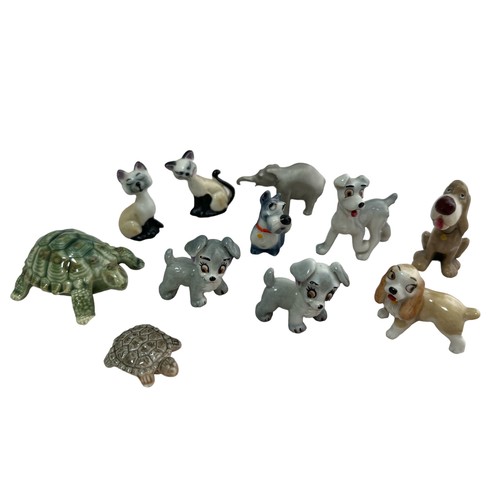 242 - Eleven animal figures, including some Wade Whimsey figures, a pewter elephant etc. Large turtle has ... 