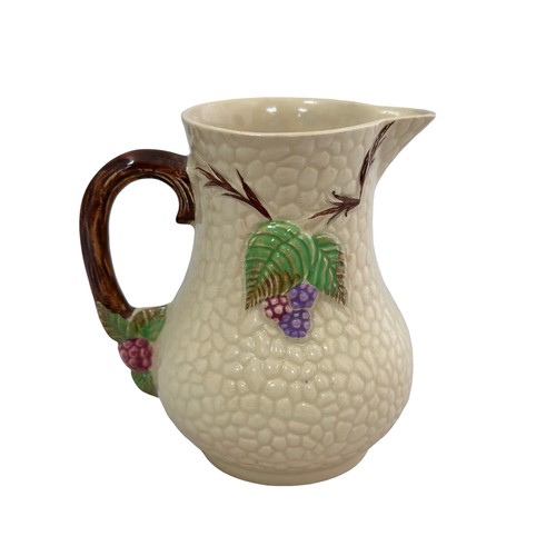 243 - A Wade Bramble jug. In good condition. Approx 11cm high.