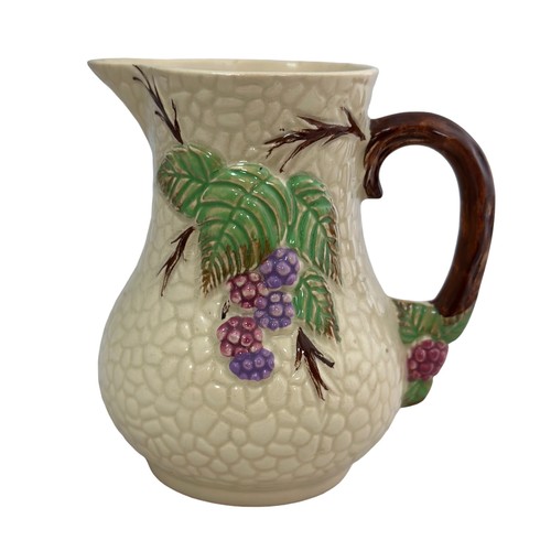 243 - A Wade Bramble jug. In good condition. Approx 11cm high.