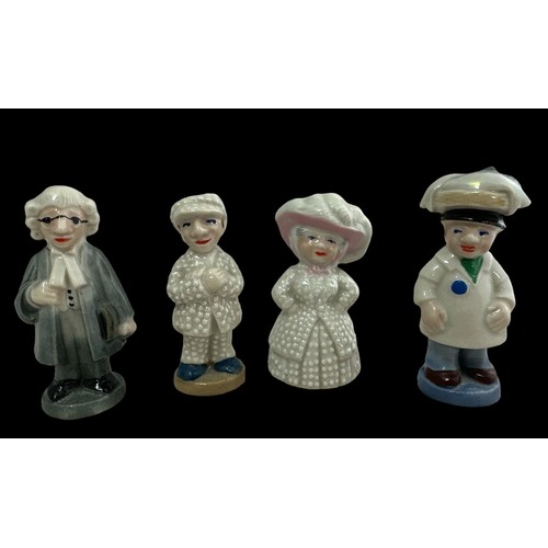 244 - Four Wade figurines - Pearly King & Queen, lawyer and fishmonger. In good condition overall. Slight ... 