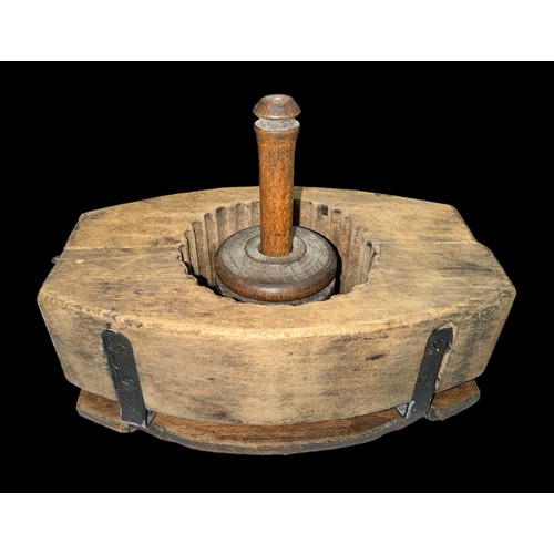 321 - Wooden butter mould decorated with a carved cow, plus a small wooden butter churner. (2)