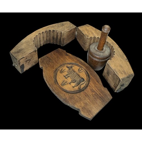 321 - Wooden butter mould decorated with a carved cow, plus a small wooden butter churner. (2)