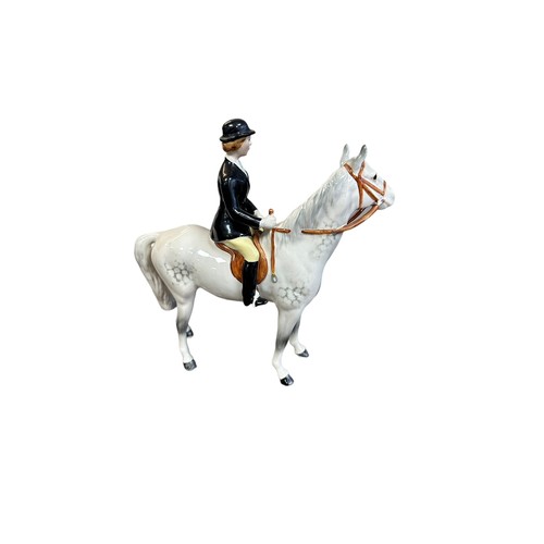 4 - Beswick ‘Hunstwoman’ figure, black jacketed huntswoman on grey horse figure. Stamped Beswick to ches... 