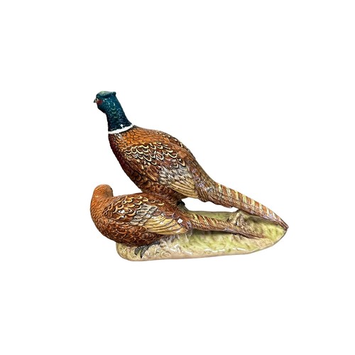 6 - Beswick, a Beswick cock and hen pheasant group figure, model no. 2078. Height 17.5cm.