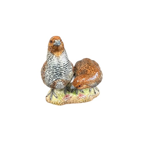 8 - Beswick, a Beswick pair of Partridges, model no. 2064. Height 15.5cm.