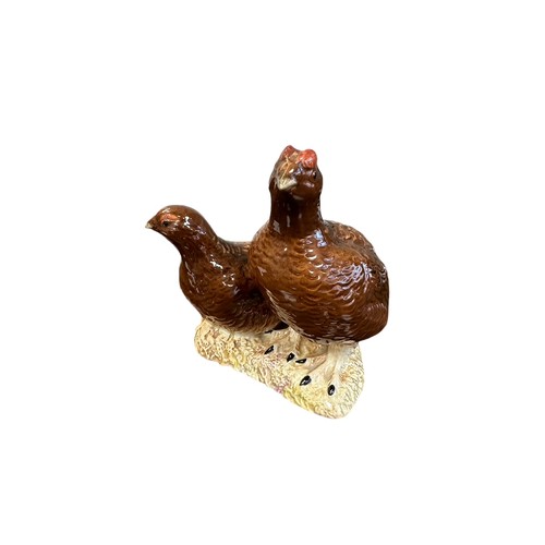 9 - Beswick, a Beswick pair of Grouse, model no. 2063. Height 15cm.