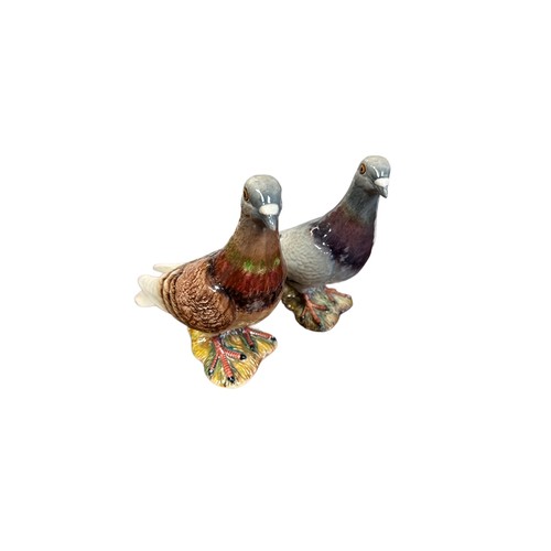 10 - Beswick, a pair of Beswick Pigeon figurines, model no. 1383, in two different colour variations, gre... 