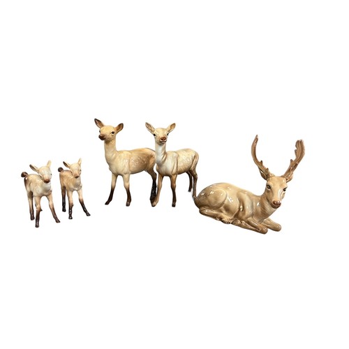 15 - Beswick, family of Deer to include; seated Stag model no. 954, Doe (x2) and Fawn (x2). Total quantit... 