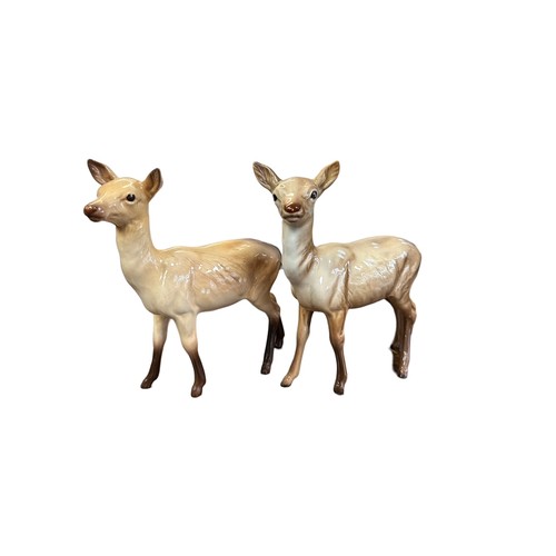 15 - Beswick, family of Deer to include; seated Stag model no. 954, Doe (x2) and Fawn (x2). Total quantit... 