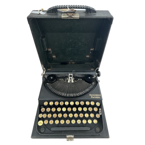 114 - A German Remington Portable Typewriter in a black case.