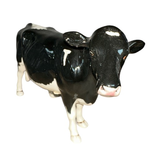 25 - Beswick, a Beswick Shetland Cow, in gloss, model no. 4112. Height 12cm.