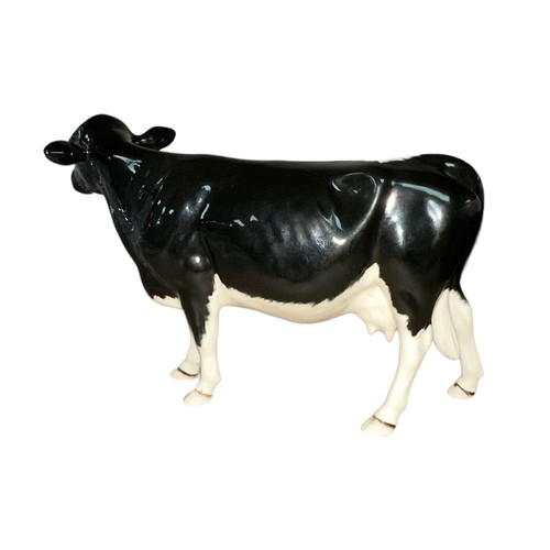 25 - Beswick, a Beswick Shetland Cow, in gloss, model no. 4112. Height 12cm.