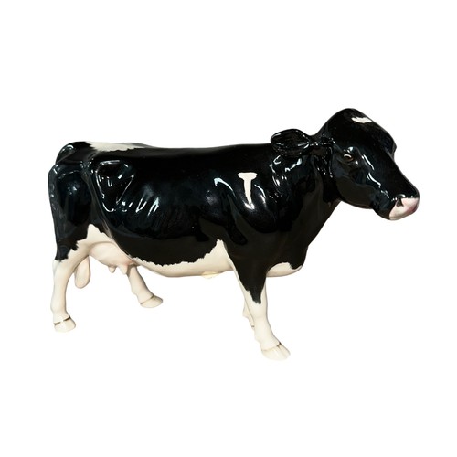 25 - Beswick, a Beswick Shetland Cow, in gloss, model no. 4112. Height 12cm.