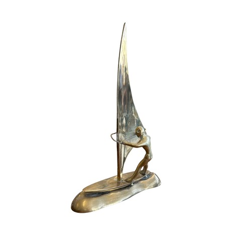 116 - Brass wind surfing figure, 24cm in height.