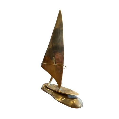 116 - Brass wind surfing figure, 24cm in height.