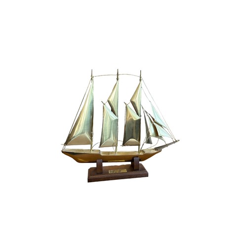 120 - Brass ship model - Sir Winston Churchill 1965. Length 27cm x height 21cm, on wooden stand.