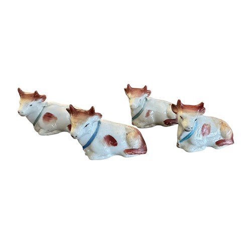 419 - Staffordshire, group of Staffordshire miniature calf figurines, five with similar design and one sma... 