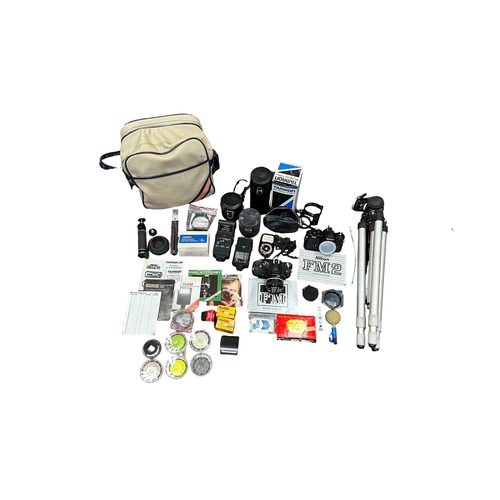 78 - Nikon FM + FM2 SLR Cameras plus accessories. Nikon FM (2345941 serial number) has a Nikkor 50mm f2 l... 