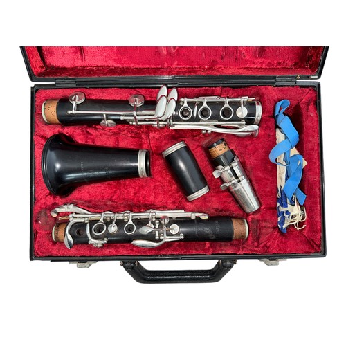 229 - A Boosey & Hawkes 'Regent' ebonised section clarinet in plush lined hard case.