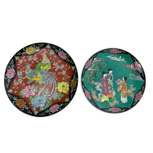 297 - Two hand painted Japanese Chargers. One green and pink colours depicting three women with a basket o... 