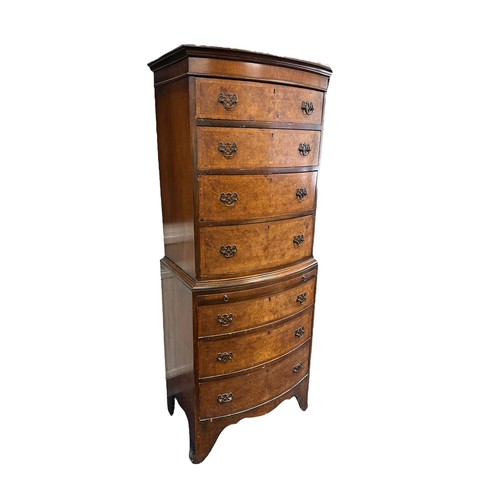 453 - A bow fronted walnut veneer 7 drawer chest of drawers with pull out desk, in 2 parts, lower 3 drawer... 