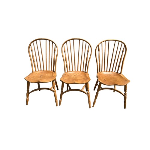 452 - Three Ercol style hoop back dining chairs.