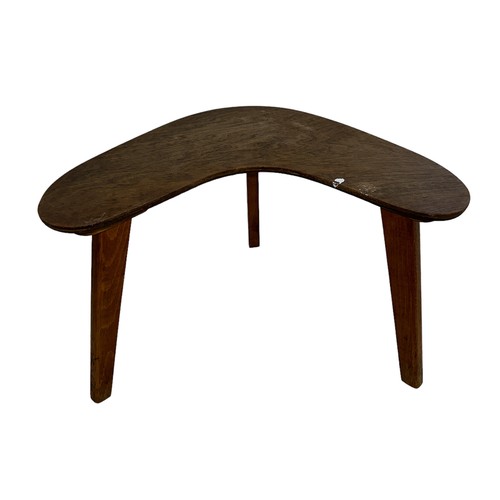 445 - A boomerang / kidney oak small table. Height 30cm, across 50cm.