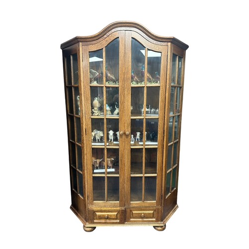 450 - Glazed display cabinet with two doors and glazed side panels over two drawers, width 130cm, depth 35... 