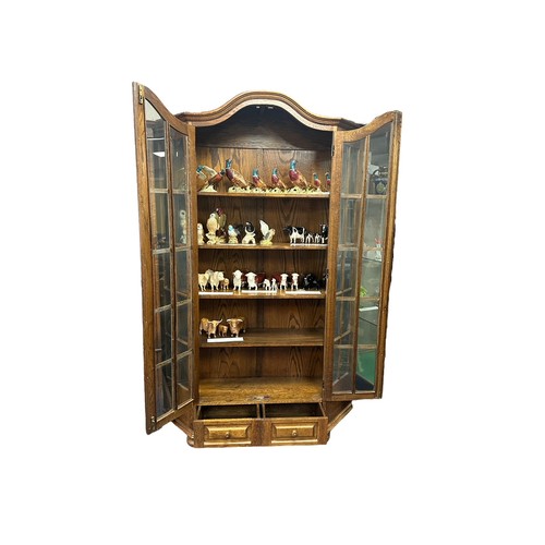 450 - Glazed display cabinet with two doors and glazed side panels over two drawers, width 130cm, depth 35... 