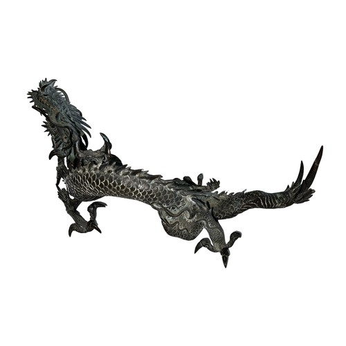 308 - Japanese large bronze model of a dragon, the creature resting on three legs with its head and arm ra... 