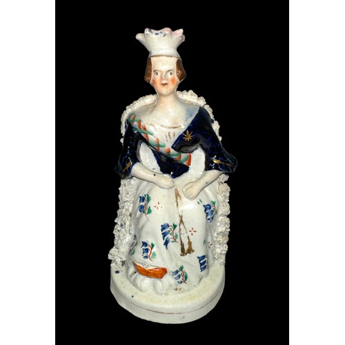 417 - Staffordshire, a Staffordshire figure of a young Queen Victoria seated on throne, hand painted. Mark... 