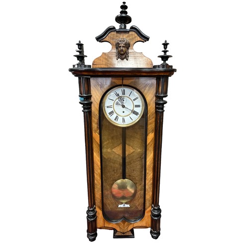 248 - An attractive wall clock. Approx 115cm tall. Wood split in some areas - see photos.