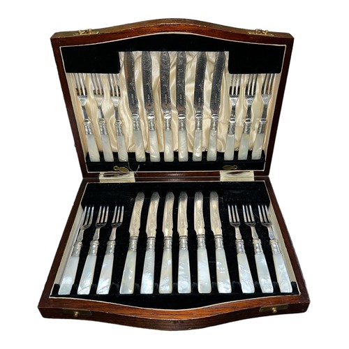 210A - A twenty-four piece Victorian silver plate dessert cutlery set with silver plated forks and blade on... 