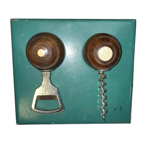 277 - Novelty vintage bowls themed bottle opener and corkscrew set, on wooden stand.