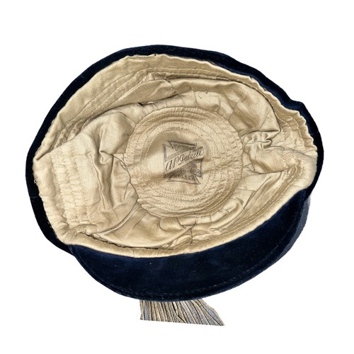 416 - A vintage blue velvet cricket cap, dated 1917. Embroidered with the letters S I and V.