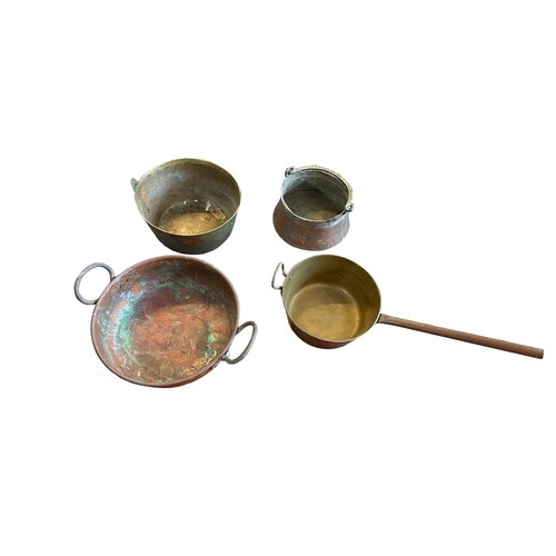 286A - Four brass/copper pans, various sizes, one with long handle.