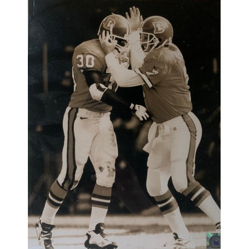 273 - ‘Bronco Mania’ black and white framed photograph of John Elway and Terrell Davis (c.1996) American F... 