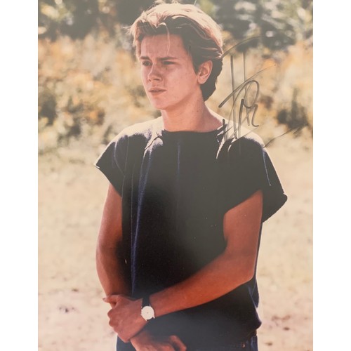 255 - River Phoenix (1970-1993) – A framed colour photograph signed by River Phoenix in black ink “River P... 