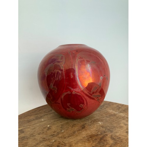 363 - A red Lustre ware hand painted vase, with hanging fruit decoration marked directly into the glaze. S... 