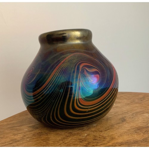 126 - John Ditchfield (British, 1952-) a iridescent purple studio glass vase with swirling pattern signed ... 